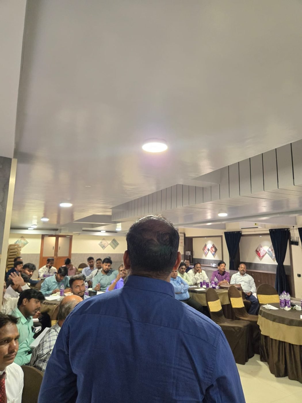 A speaker addressing delegates during an IBG Wellness session
